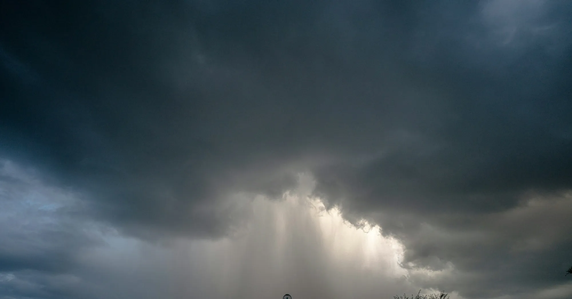 Rain shaft falling from a dark storm cloud